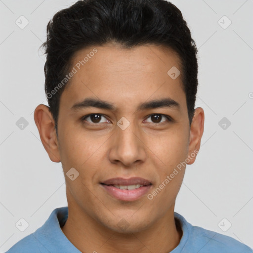 Joyful latino young-adult male with short  brown hair and brown eyes