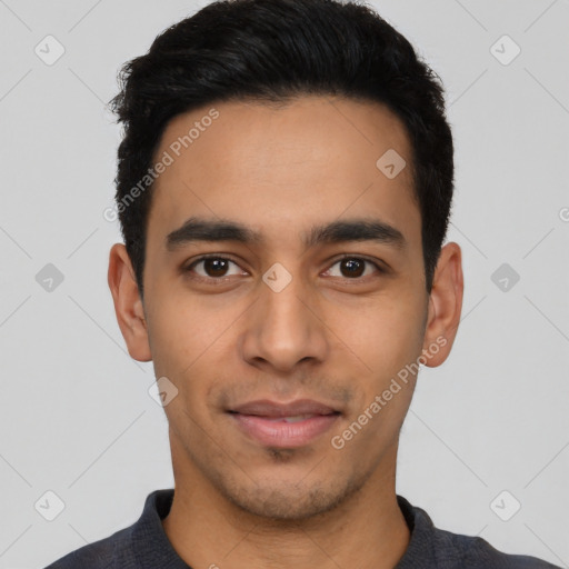 Joyful latino young-adult male with short  black hair and brown eyes