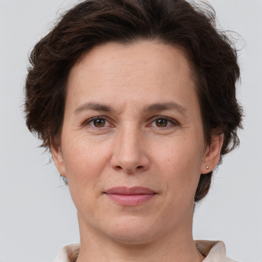 Joyful white adult female with short  brown hair and brown eyes