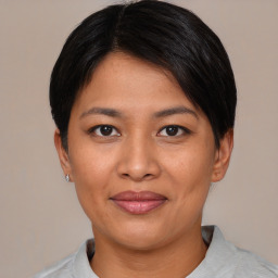 Joyful asian young-adult female with short  black hair and brown eyes