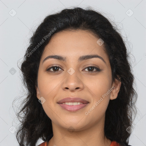 Joyful latino young-adult female with long  brown hair and brown eyes