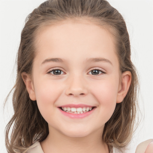 Joyful white child female with medium  brown hair and grey eyes