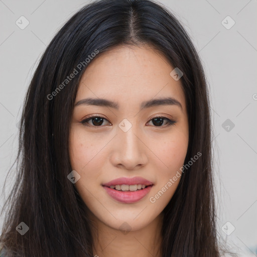 Joyful asian young-adult female with long  brown hair and brown eyes