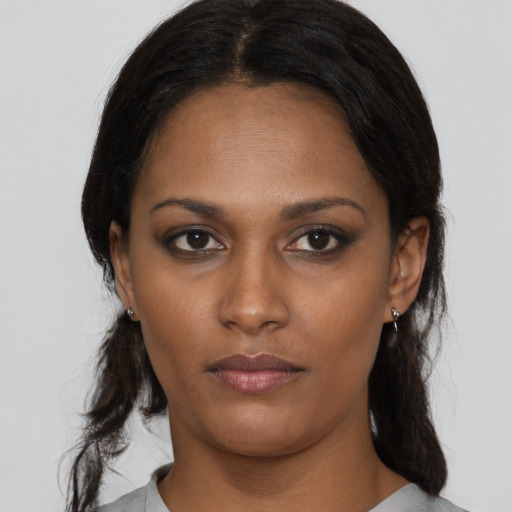 Neutral black young-adult female with medium  black hair and brown eyes