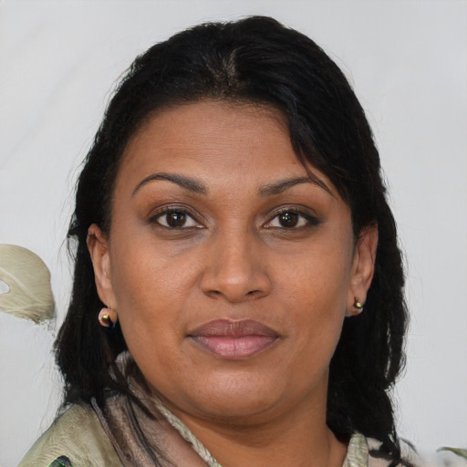 Joyful asian adult female with medium  brown hair and brown eyes