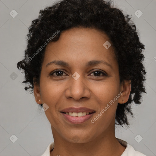 Joyful latino adult female with short  brown hair and brown eyes