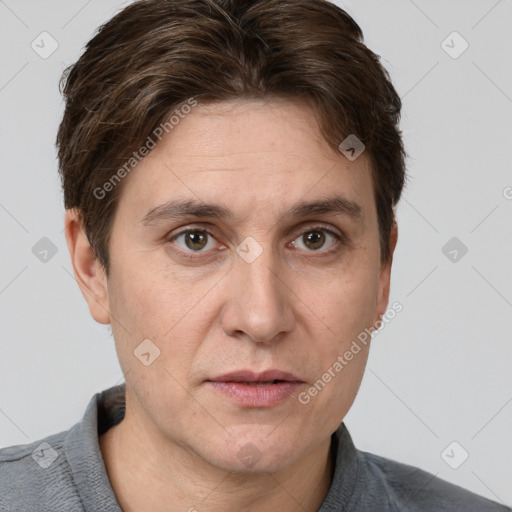 Joyful white adult male with short  brown hair and grey eyes