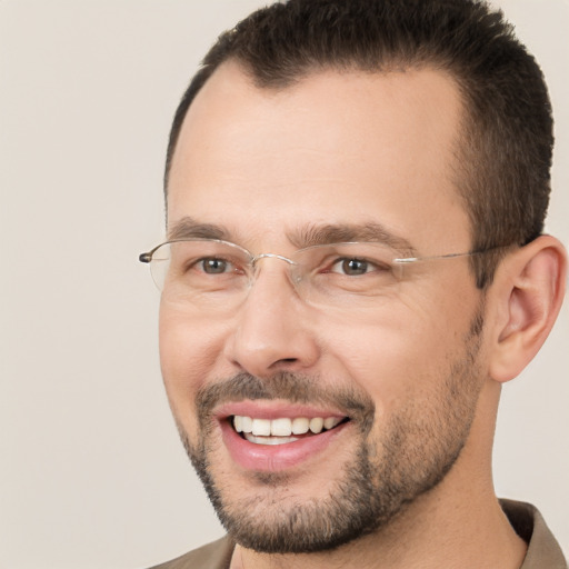 Joyful white adult male with short  brown hair and brown eyes