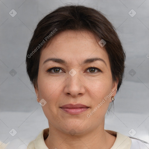 Joyful white adult female with short  brown hair and brown eyes