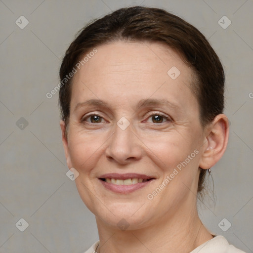 Joyful white adult female with short  brown hair and brown eyes