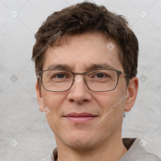 Joyful white adult male with short  brown hair and grey eyes