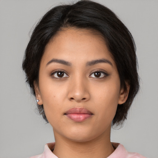 Neutral latino young-adult female with medium  black hair and brown eyes