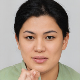 Joyful asian young-adult female with medium  brown hair and brown eyes