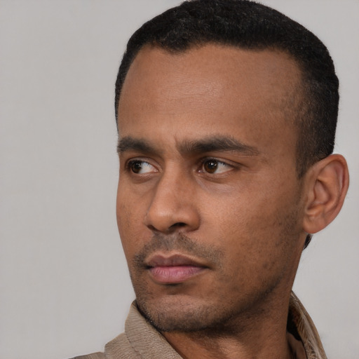 Neutral latino young-adult male with short  black hair and brown eyes