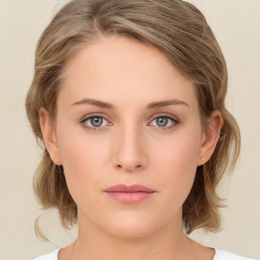 Neutral white young-adult female with medium  brown hair and green eyes