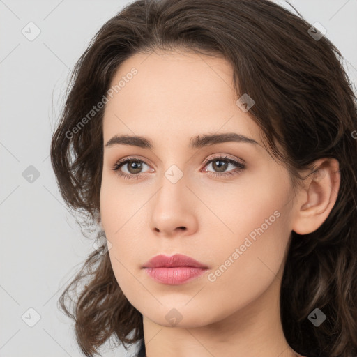 Neutral white young-adult female with long  brown hair and brown eyes