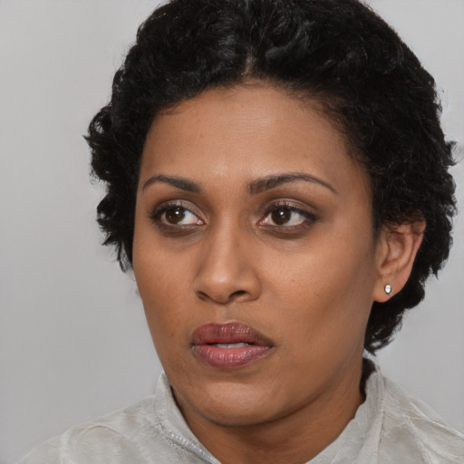 Neutral black young-adult female with short  black hair and brown eyes