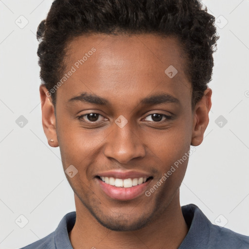 Joyful black young-adult male with short  brown hair and brown eyes