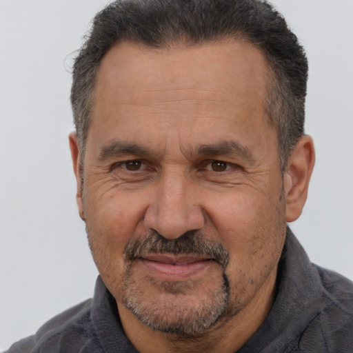 Joyful white middle-aged male with short  brown hair and brown eyes