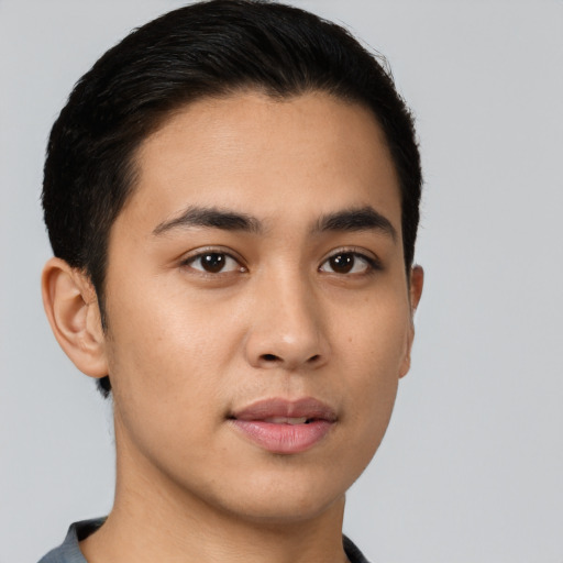 Neutral latino young-adult male with short  brown hair and brown eyes