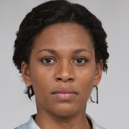 Neutral black young-adult female with short  brown hair and brown eyes