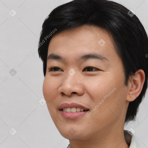 Joyful asian young-adult male with short  black hair and brown eyes