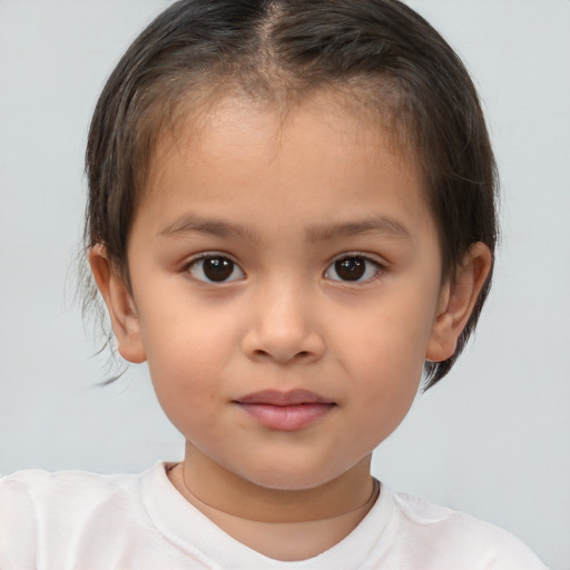 Joyful white child female with short  brown hair and brown eyes