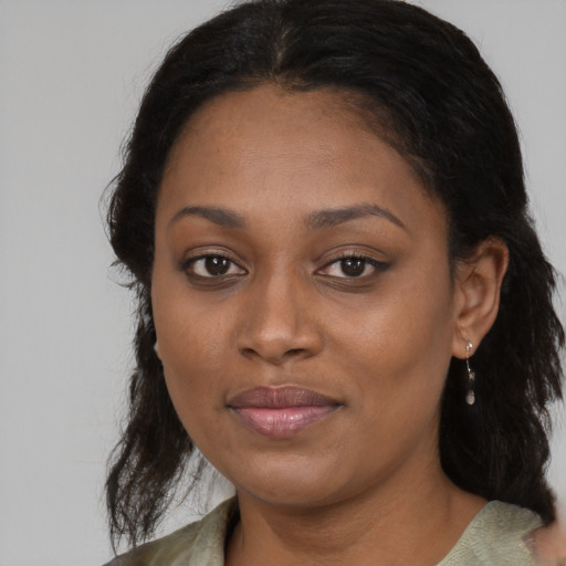 Joyful black young-adult female with medium  brown hair and brown eyes