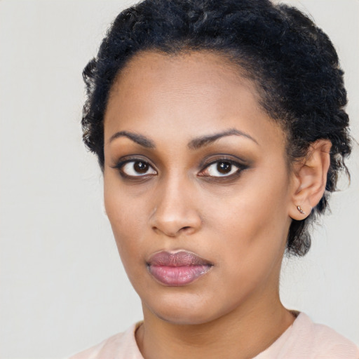 Neutral black young-adult female with short  black hair and brown eyes
