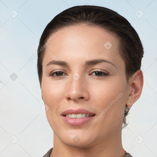 Joyful white young-adult female with short  brown hair and brown eyes