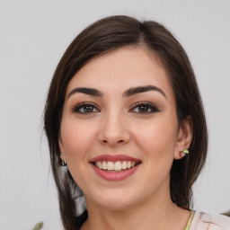 Joyful white young-adult female with medium  brown hair and brown eyes