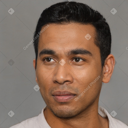 Neutral latino young-adult male with short  black hair and brown eyes
