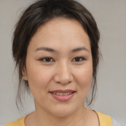 Joyful white young-adult female with medium  brown hair and brown eyes