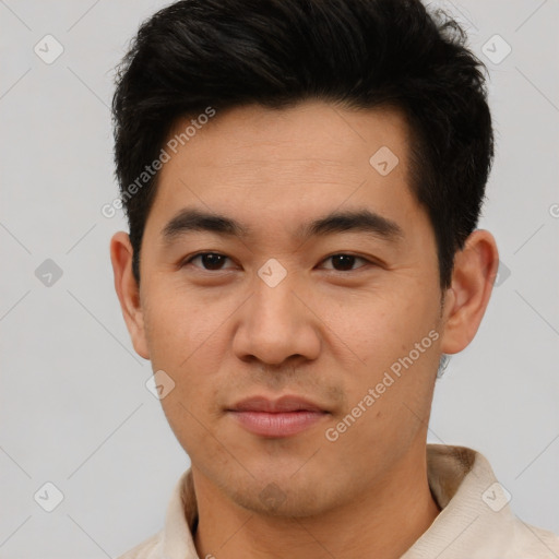 Joyful asian young-adult male with short  black hair and brown eyes