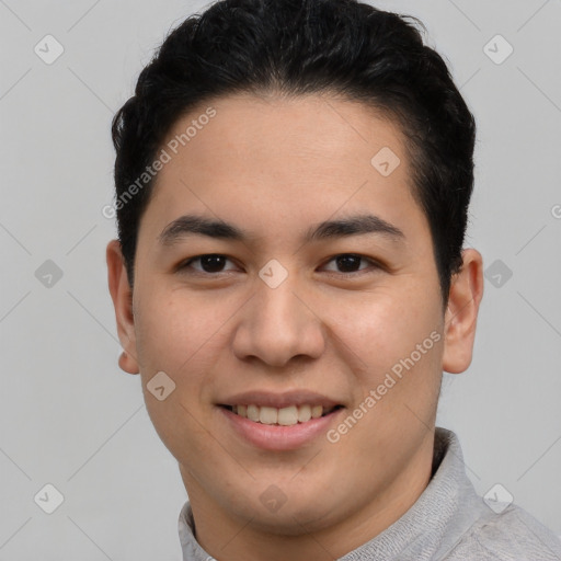 Joyful latino young-adult male with short  brown hair and brown eyes