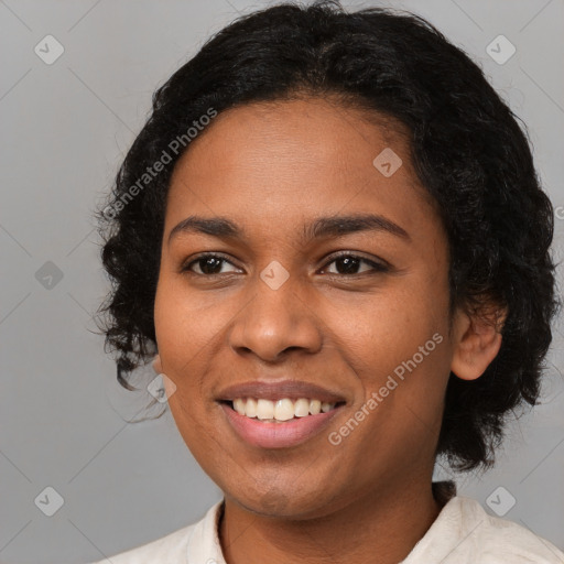 Joyful black young-adult female with medium  brown hair and brown eyes