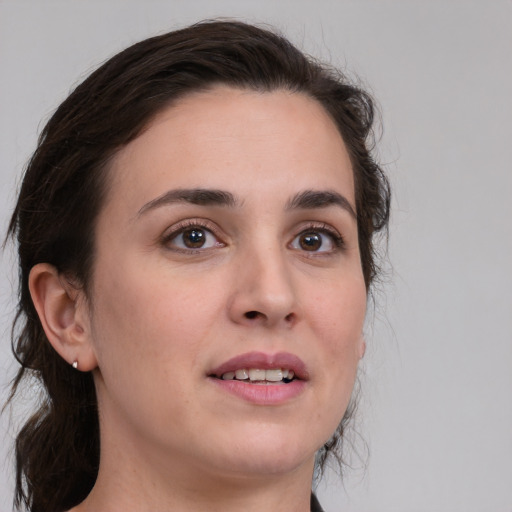 Joyful white young-adult female with medium  brown hair and brown eyes