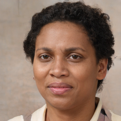 Joyful latino adult female with short  brown hair and brown eyes