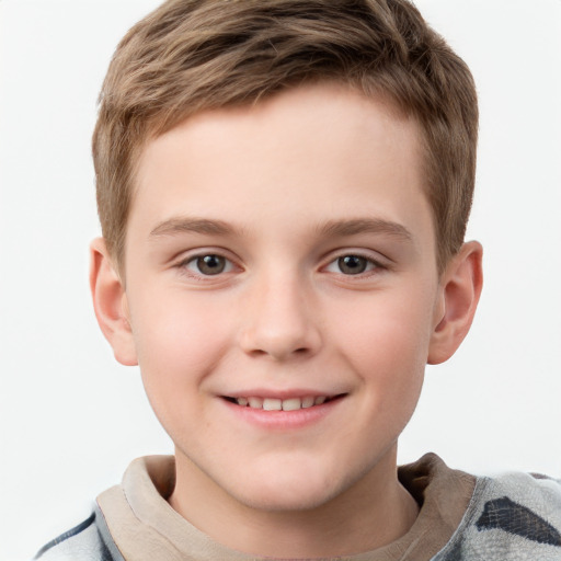 Joyful white child male with short  brown hair and grey eyes