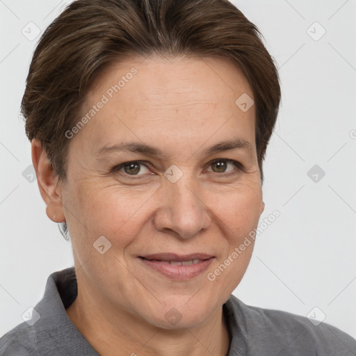 Joyful white adult female with short  brown hair and brown eyes