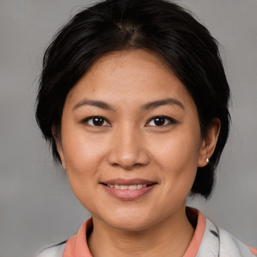 Joyful white young-adult female with medium  brown hair and brown eyes