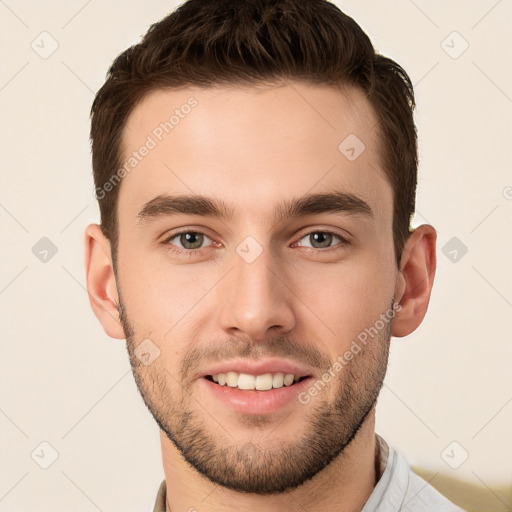 Joyful white young-adult male with short  brown hair and brown eyes