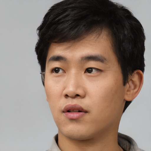 Neutral asian young-adult male with short  black hair and brown eyes
