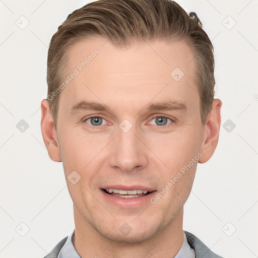 Joyful white young-adult male with short  brown hair and grey eyes