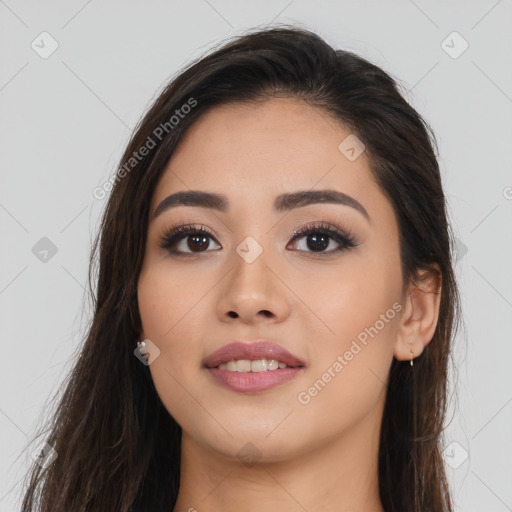 Joyful asian young-adult female with long  brown hair and brown eyes