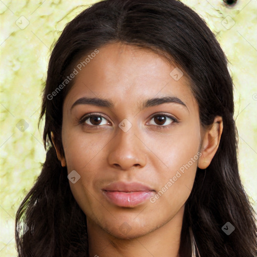 Joyful latino young-adult female with long  brown hair and brown eyes