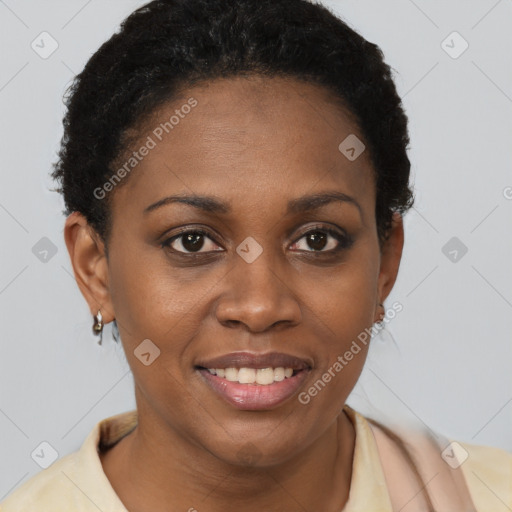 Joyful black young-adult female with short  brown hair and brown eyes