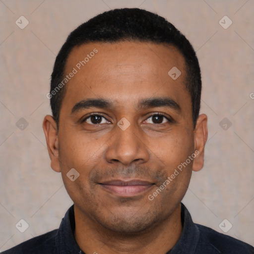 Joyful latino young-adult male with short  black hair and brown eyes