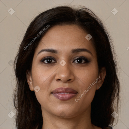 Joyful latino young-adult female with long  brown hair and brown eyes