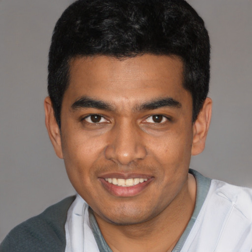 Joyful latino young-adult male with short  black hair and brown eyes